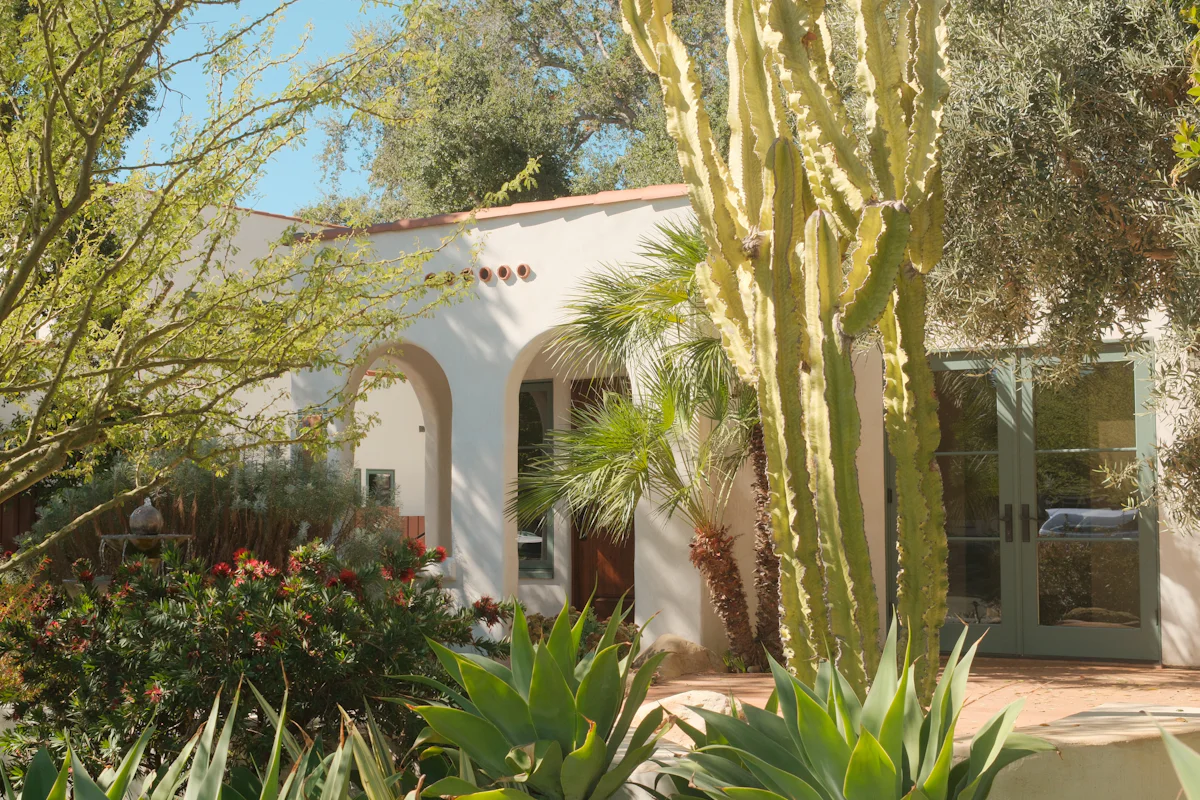 A Spanish-style home with desert landscaping