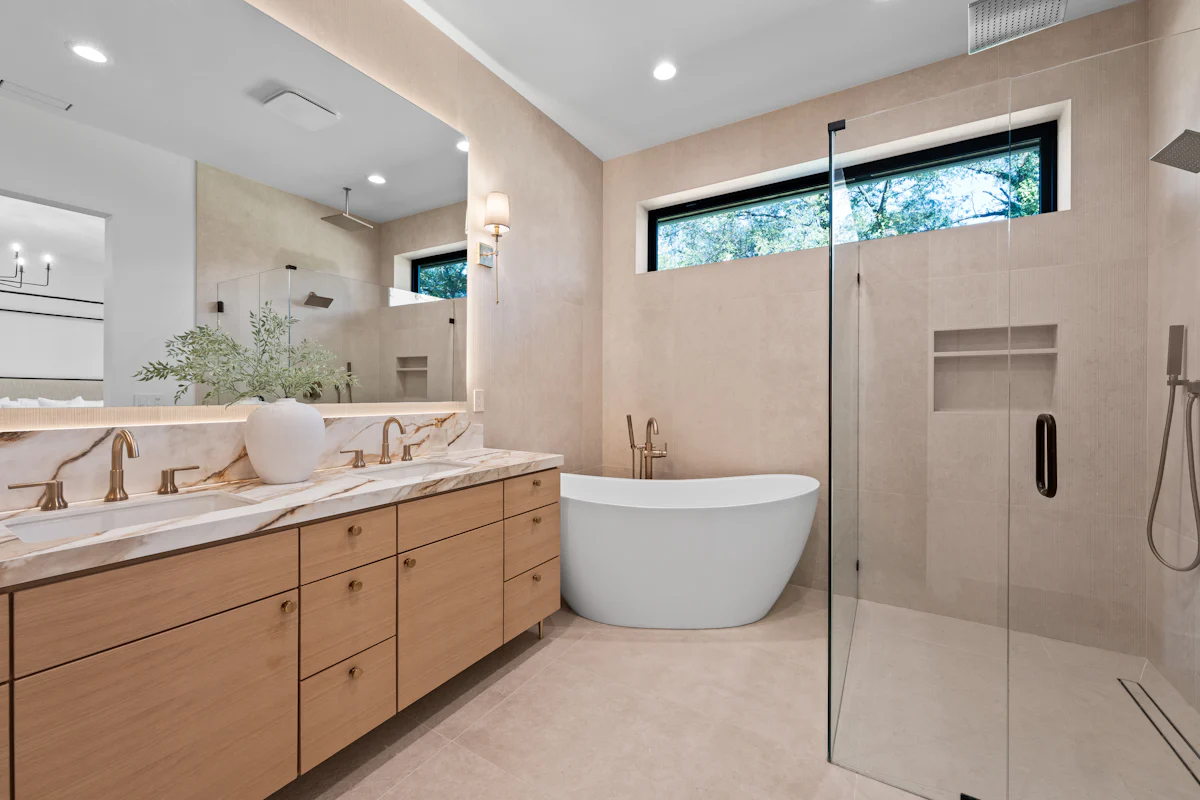 A finished bathroom remodel with a freestanding tub and double vanity