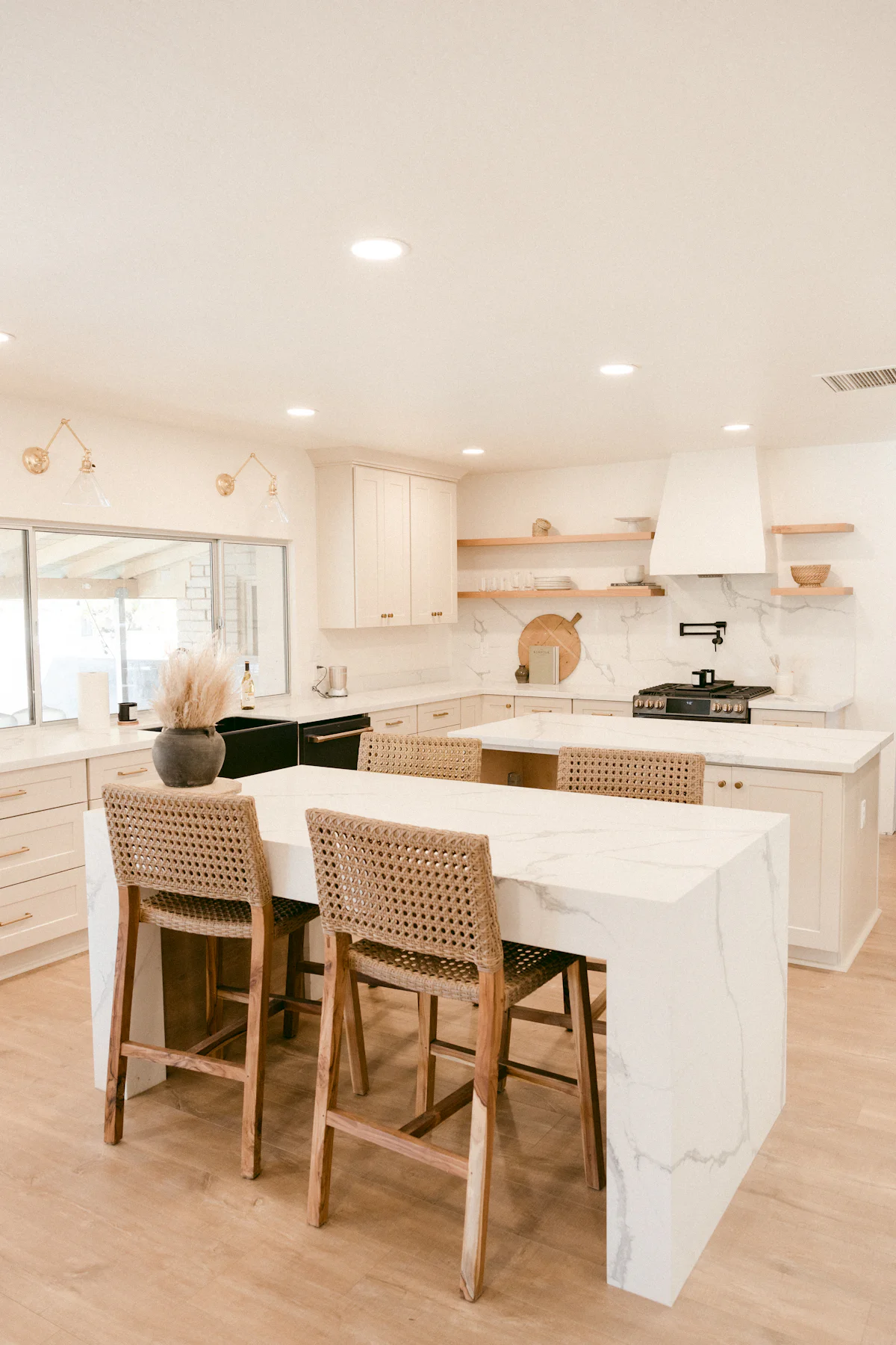 A bright remodeled kitchen with marble islands